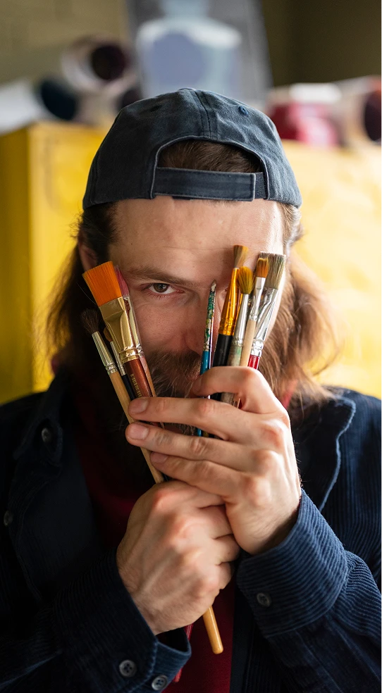 Art supplies laid out on a studio countertop
